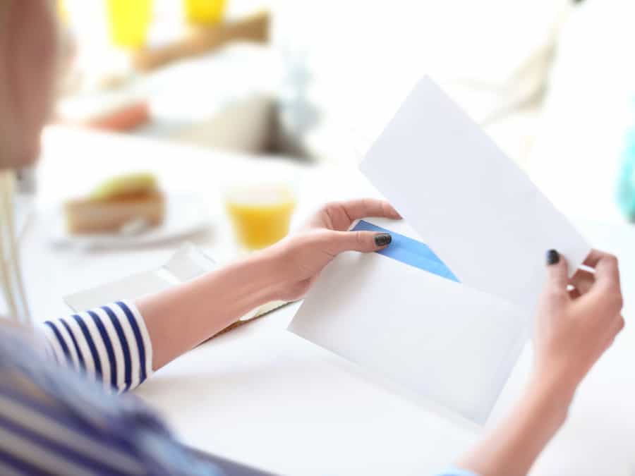 Woman Filling Envelope