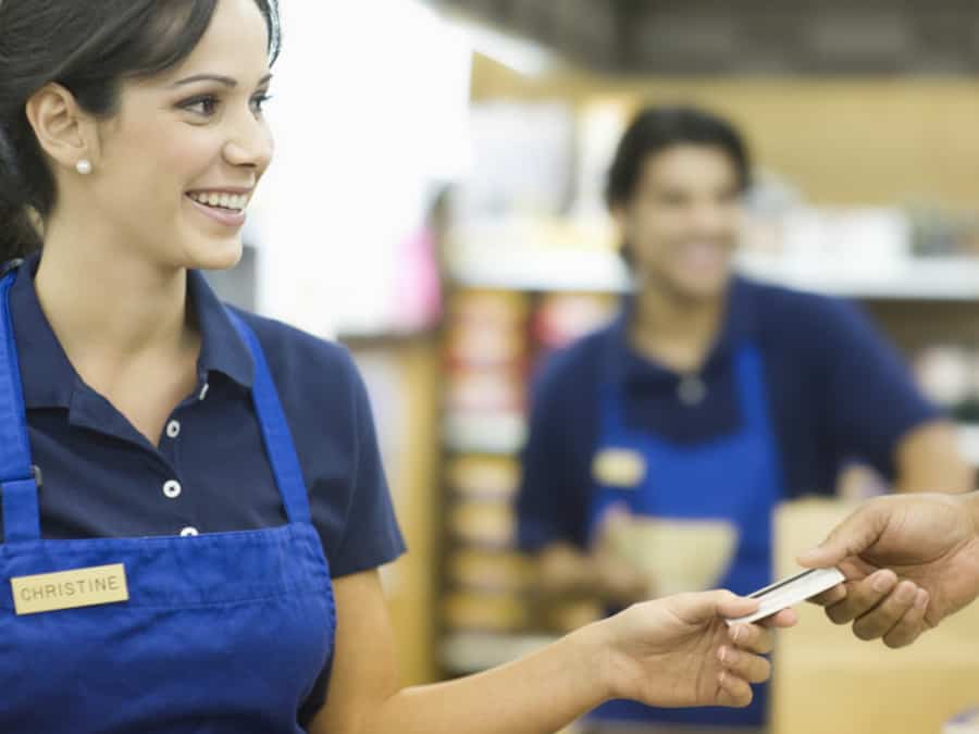 Person Handing Over Loyalty Card